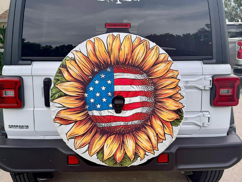 Jeep Wrangler JLU with American flag sunflower tire cover
