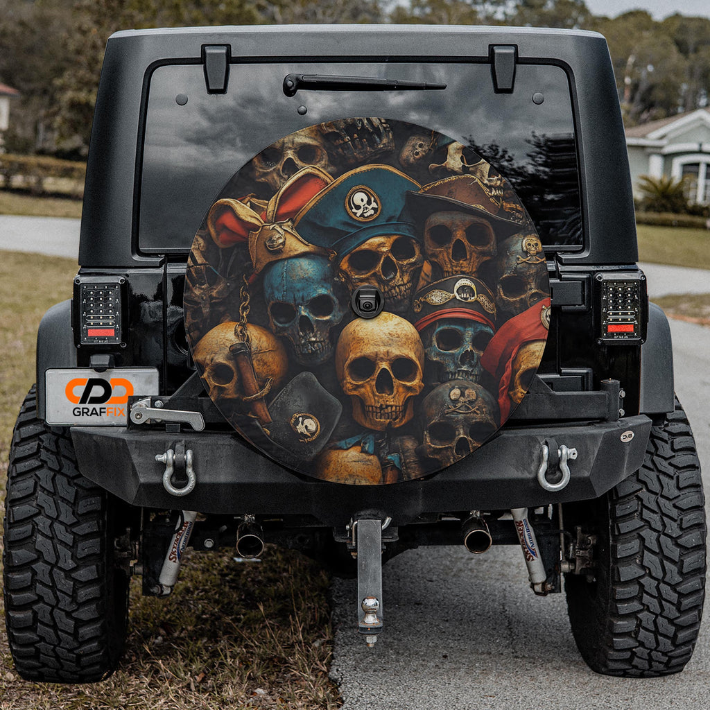 Pirate skulls tire cover on black Jeep Wrangler showing aged skulls in colorful pirate captain headwear