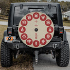 a black jeep with a large, round, red and white sticker on the rear window. The sticker features various Chinese zodiac animals, including a pig, a dog, a cat, a rooster, a rabbit, a snake, a horse, a monkey, a dragon, a horse, a monkey, and a rabbit.