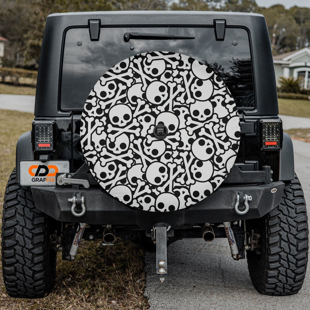 Skull and crossbones tire cover on red Jeep Wrangler showing black-and-white cartoon skull and bone repeat