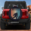 Sasquatch Stripes spare tire cover on red Bronco with retro vintage Bigfoot striped silhouette design