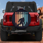 Sasquatch Stripes spare tire cover on red Bronco with retro vintage Bigfoot striped silhouette design