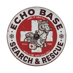a circular logo with a red background and white border. The logo includes a cartoon image of a dog wearing a backpack and goggles, along with the text "ECHO BASE SEARCH & RESCUE".