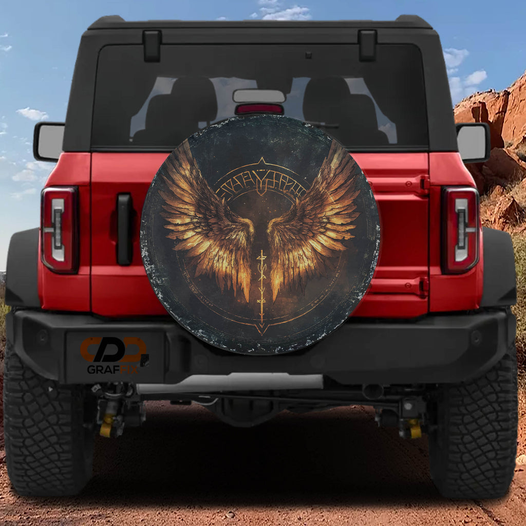 Flat Norse Valkyrie wings spare tire cover artwork with golden feathered wings and rune circle on dark canvas