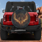 Flat Norse Valkyrie wings spare tire cover artwork with golden feathered wings and rune circle on dark canvas
