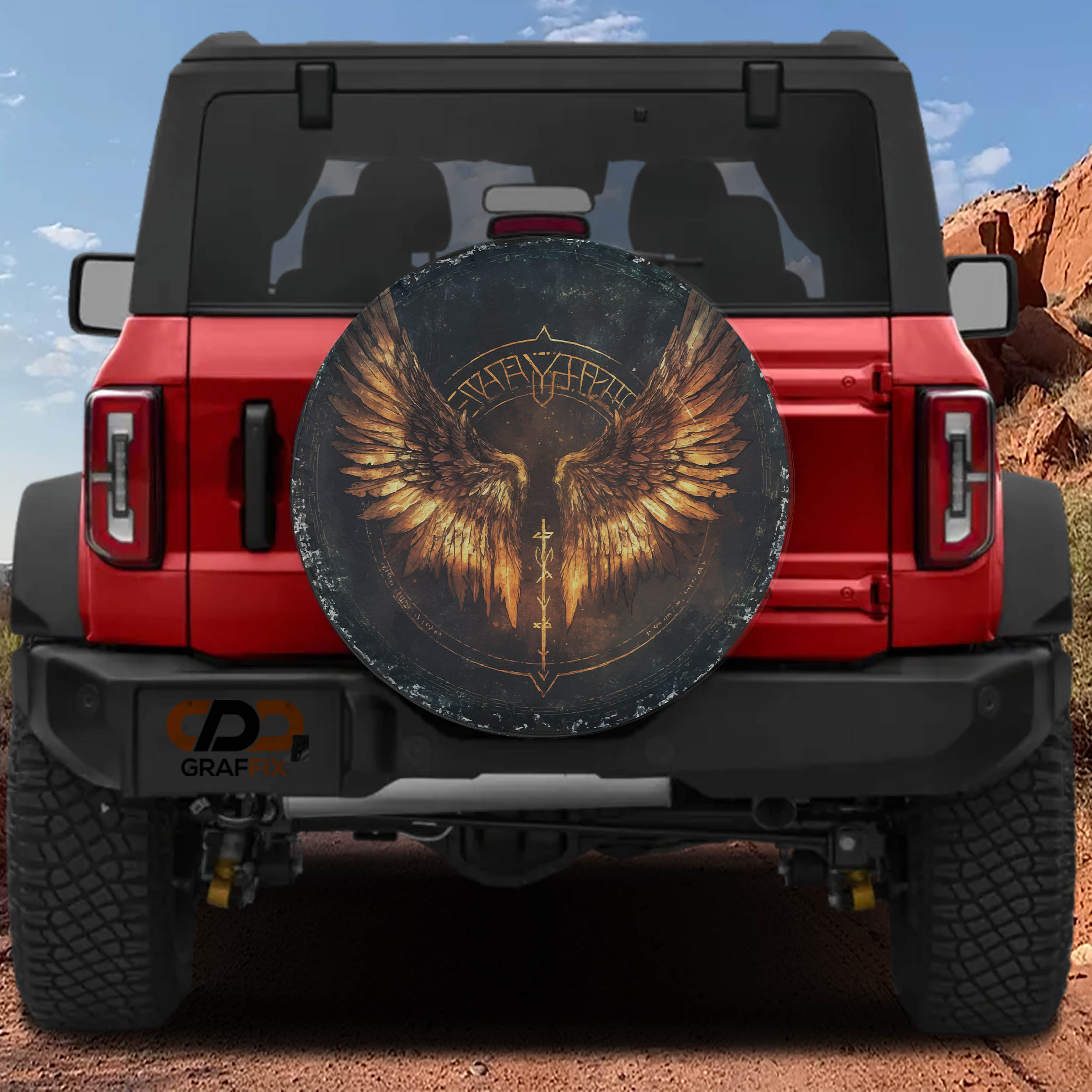 Flat Norse Valkyrie wings spare tire cover artwork with golden feathered wings and rune circle on dark canvas