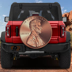 Giant American penny spare tire cover on black Jeep Wrangler with Abraham Lincoln penny