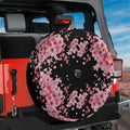 Japanese pink cherry blossom black background spare tire cover installed on red Jeep Wrangler rear