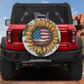 Star-Spangled Sunflower spare tire cover on a red Jeep Wrangler showing the patriotic flag-and-bloom rear design