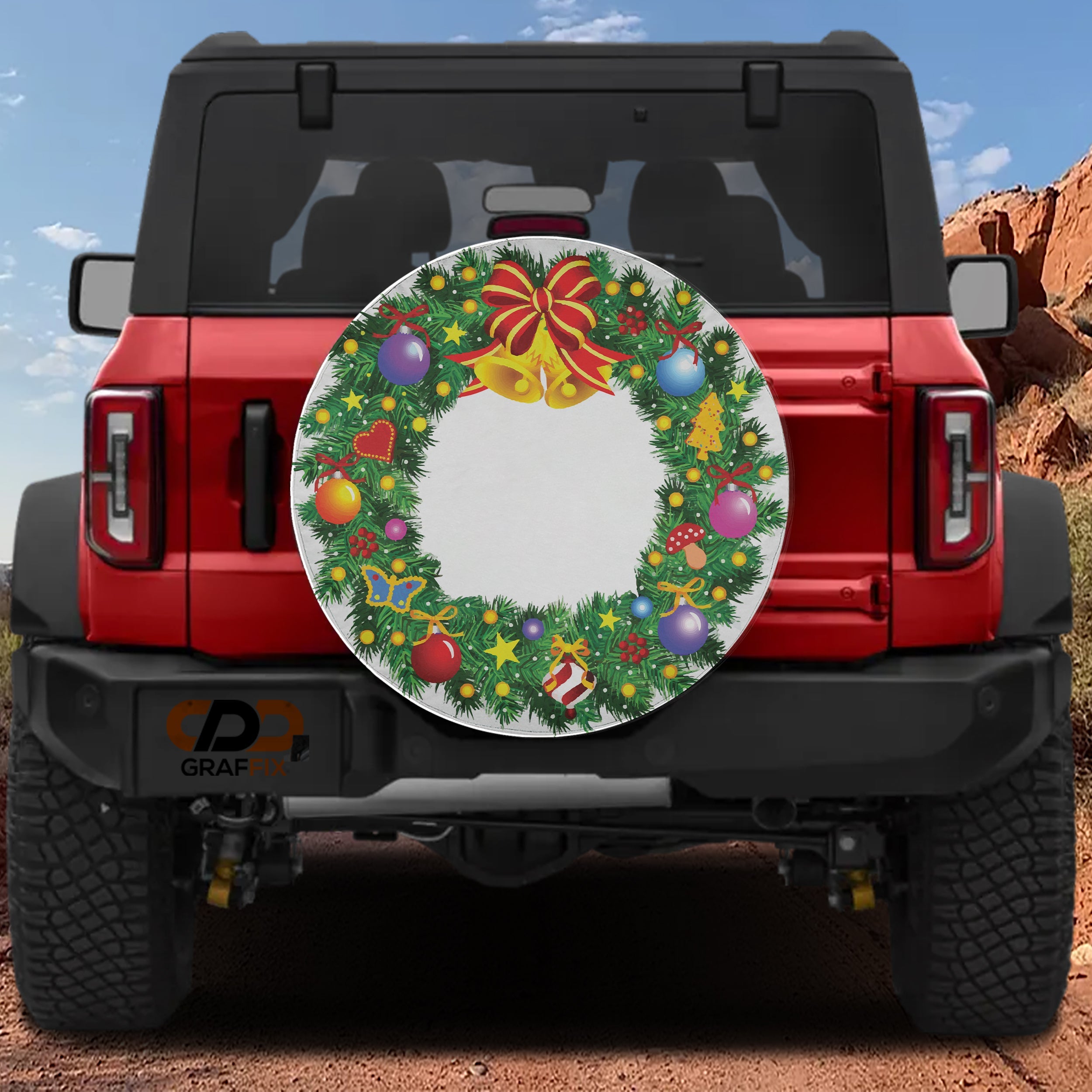 Red Ford Bronco rear displaying Christmas wreath spare tire cover with bells bow and bright ornaments