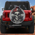 Pirate skull crossbones and red tricorn hat spare tire cover mounted on red Ford Bronco rear gate