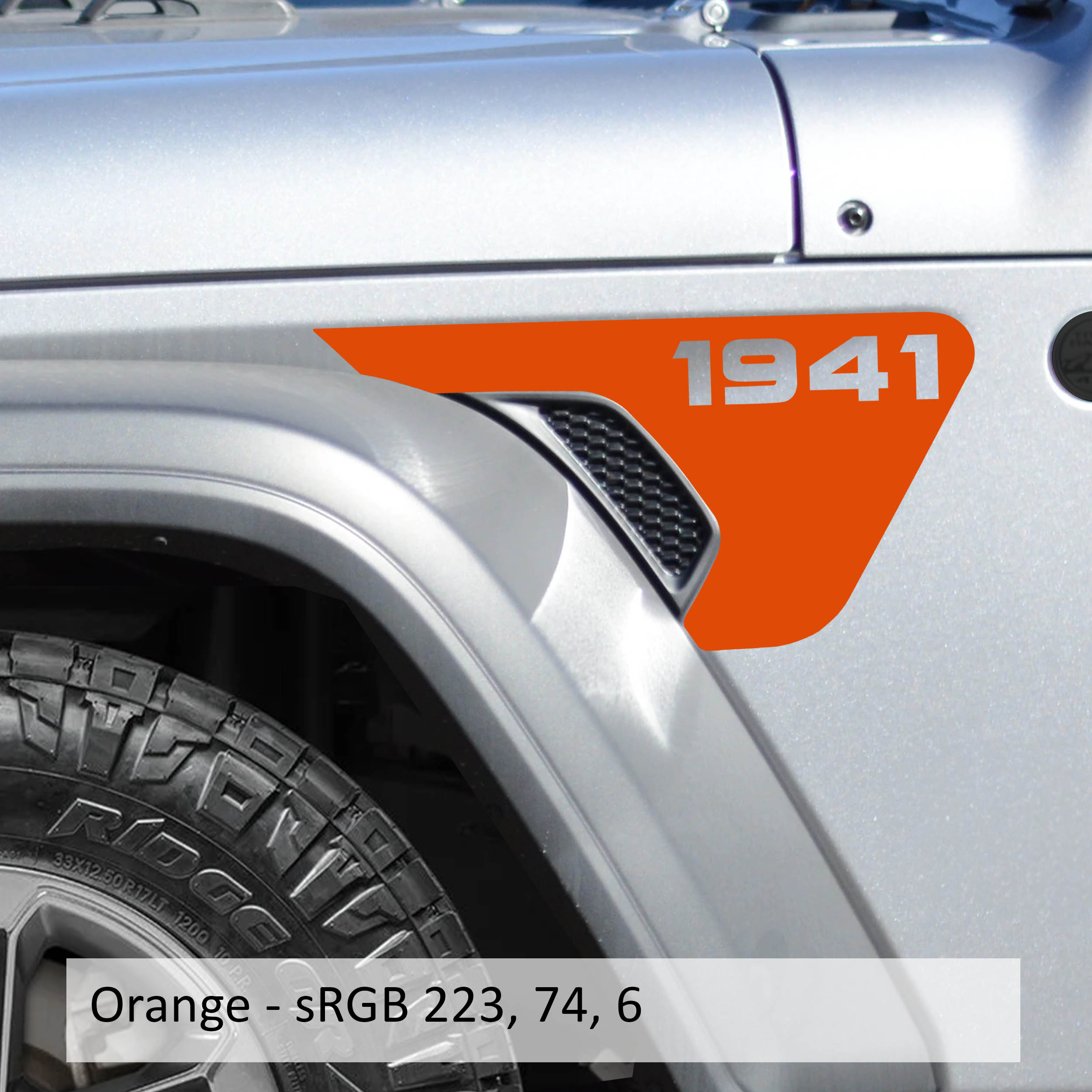 Orange 1941 Jeep Wrangler fender vent transfer decal applied to billet vent insert close-up view