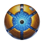 a futuristic, metallic object with a blue and gold color scheme. The object appears to be a metallic sphere or capsule with a central black camera lens.