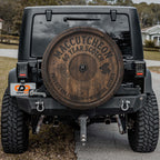 a black Jeep Wrangler with a large wooden barrel on the rear of the vehicle.