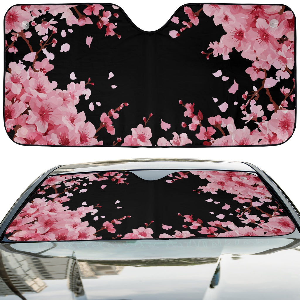 Japanese Cherry Blossom accordion sunshade installed in a sedan windshield on a sunny city street view