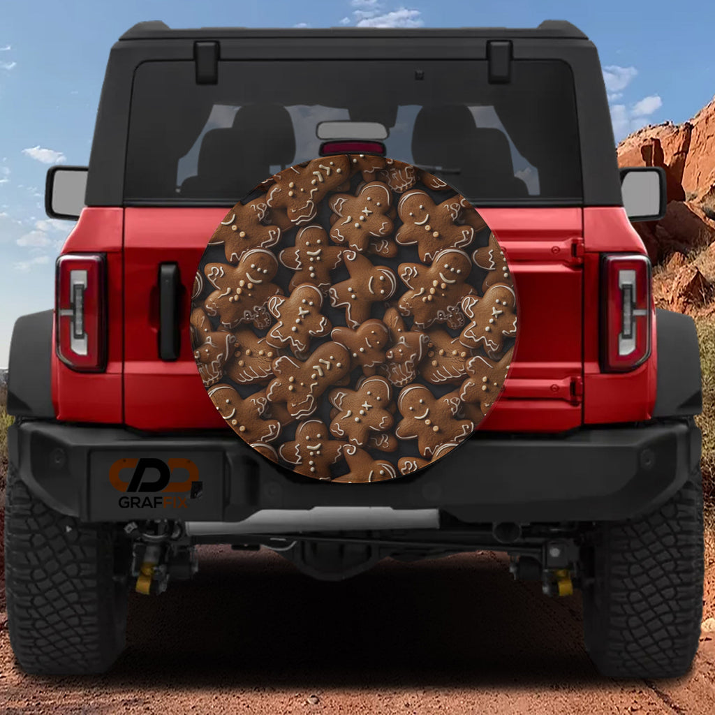 Gingerbread cookies pattern spare tire cover on red Ford Bronco showing iced brown holiday cookies