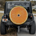 Orange fruit spare tire cover with vibrant citrus slice graphic and bright orange peel design