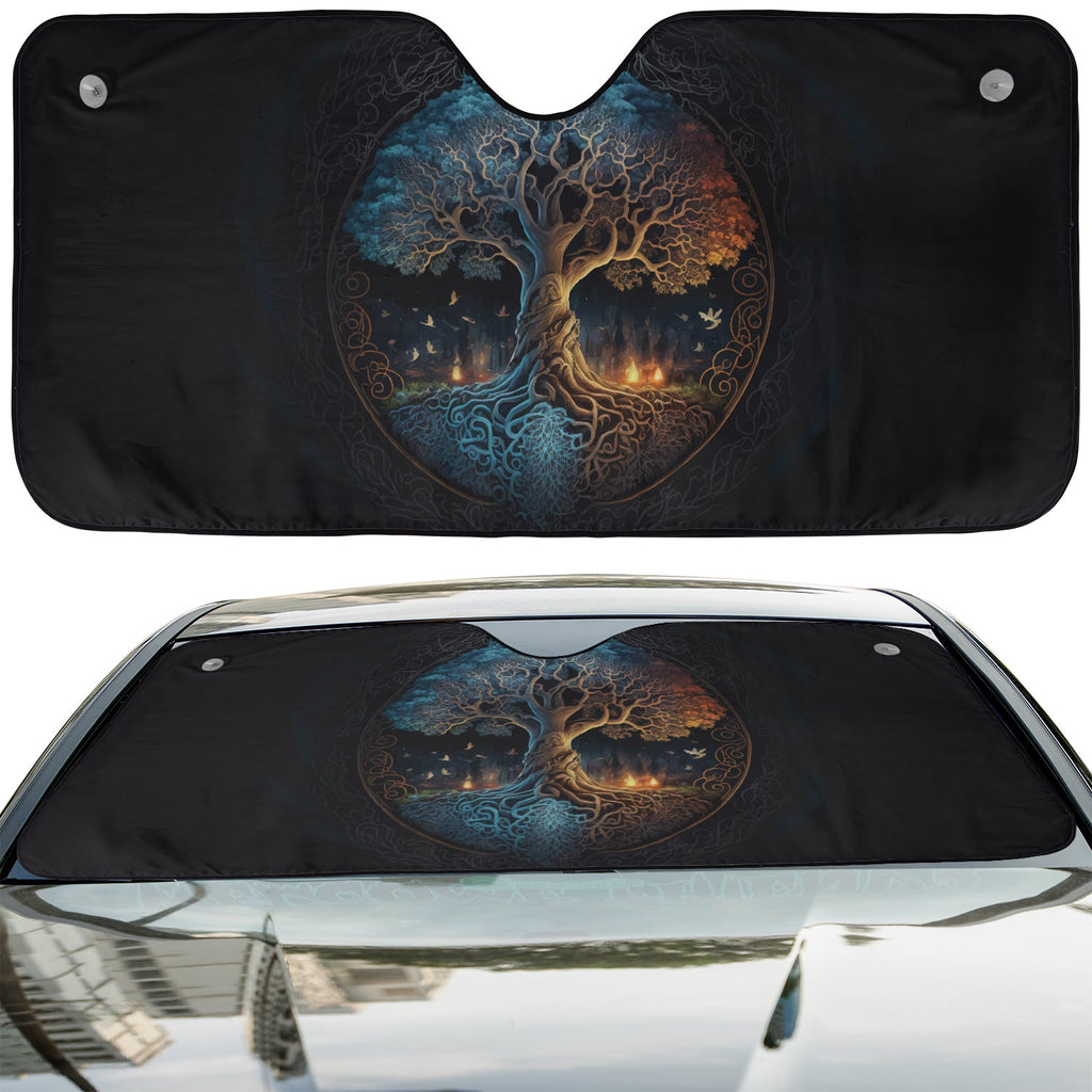 Norse Tree of Life accordion sunshade installed in a sedan windshield on a sunny urban city street view