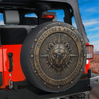 a red Jeep with a large, decorative spare tire cover on the back. The cover has a bear head design and the words "Adventure Awaits" and "Explore the Wilderness" written on it.
