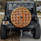 Maple syrup Belgian waffle spare tire cover mounted on black Jeep Wrangler rear outdoors
