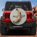Duct-Taped Banana spare tire cover with art parody design shown on red Bronco CDD GRAFFIX badge