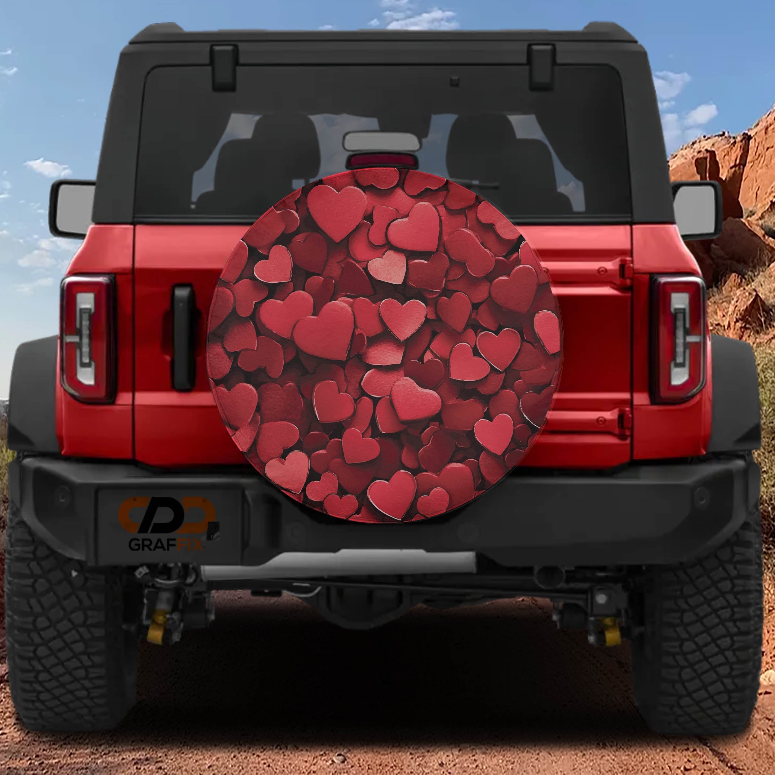 Love on Wheels spare tire cover on red Bronco showing matte layered red Valentine hearts design
