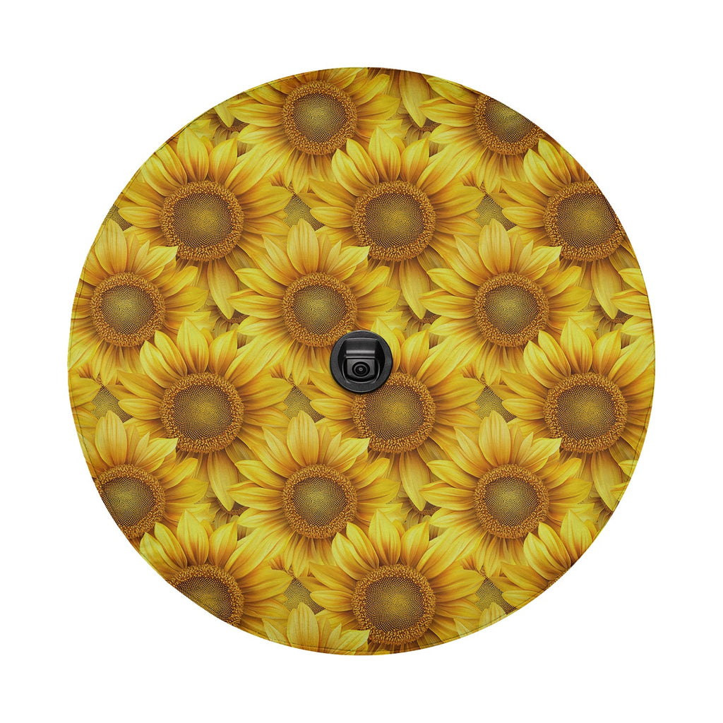 Sunflower tire cover studio close-up with dense yellow blooms and centered black camera cutout for rearview