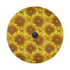 Sunflower tire cover studio close-up with dense yellow blooms and centered black camera cutout for rearview