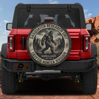 a red Jeep Wrangler with a large tire cover on the back, displaying a Sasquatch logo and text related to the Sasquatch Research Unit.