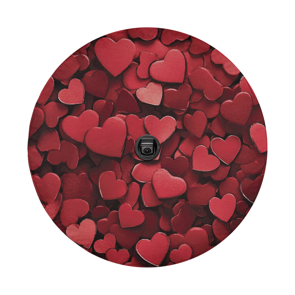 Love on Wheels spare tire cover close-up detail of overlapping red love hearts art texture
