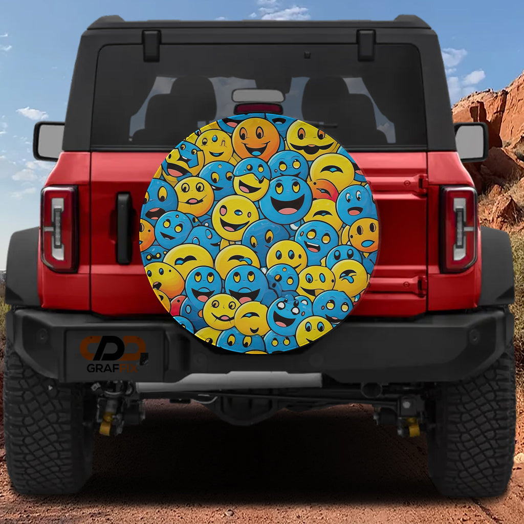 Yellow and blue smiley face cluster tire cover on red Ford Bronco rear gate with red rock canyon view