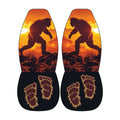 a pair of shoes with a unique design, including a silhouette of a large, furry creature and two feet with an intricate, claw-like pattern.