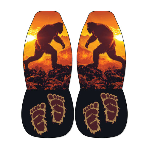 a pair of shoes with a unique design, including a silhouette of a large, furry creature and two feet with an intricate, claw-like pattern.
