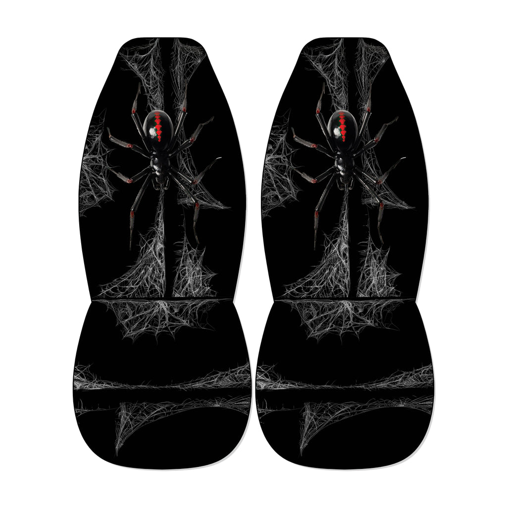 a pair of black car seat covers with a spider design on them.