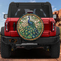 Peacock stained glass mosaic spare tire cover on red Ford Bronco with blue green feather plumage