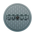 Sewer manhole cover spare tire cover alternate angle showing full graphic