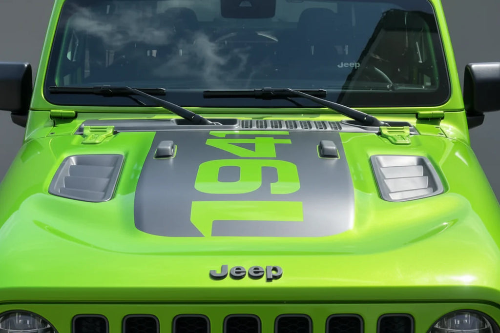 Bright green Jeep Wrangler Rubicon featuring 1941 power-dome blackout hood decal front view