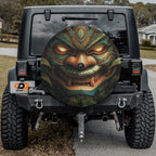 Tiki Totem of Fury spare tire cover rear angle on red Jeep featuring tribal wooden warrior face
