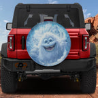 Yeti Peek-a-Boo spare tire cover on a red Jeep Wrangler showing the cheeky cartoon yeti peeking from the rear cover