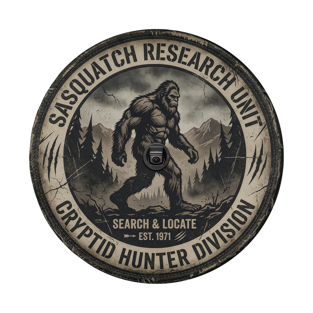 a large, muscular Sasquatch-like creature walking through a forested area with mountains in the background.