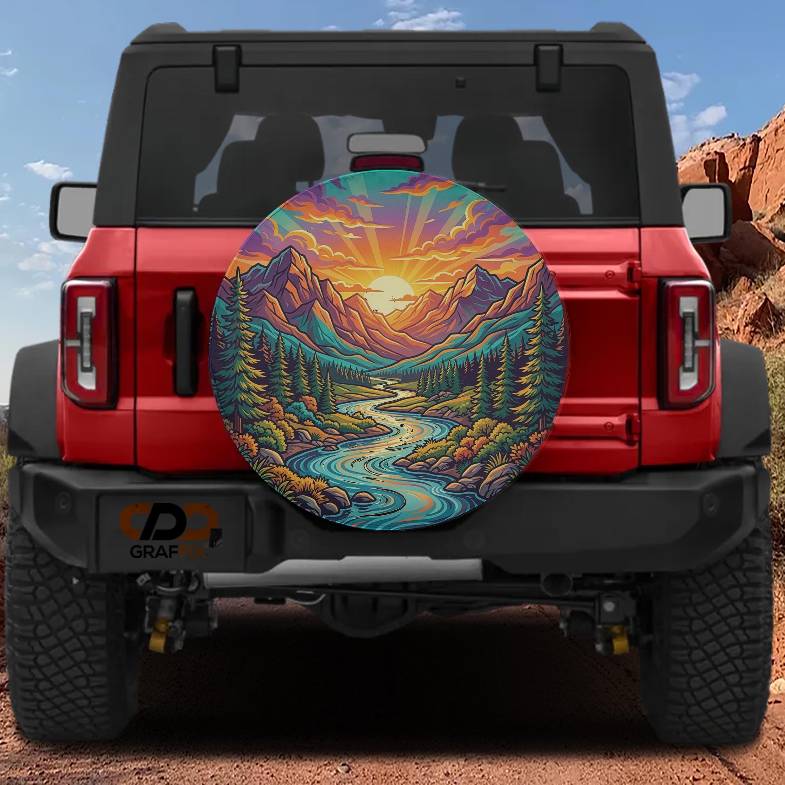 a red Jeep Wrangler with a large, colorful wheel cover depicting a scenic mountain landscape with a winding river.