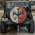 Balance of the Dragons spare tire cover on black Jeep Wrangler rear with carved twin dragons on tailgate