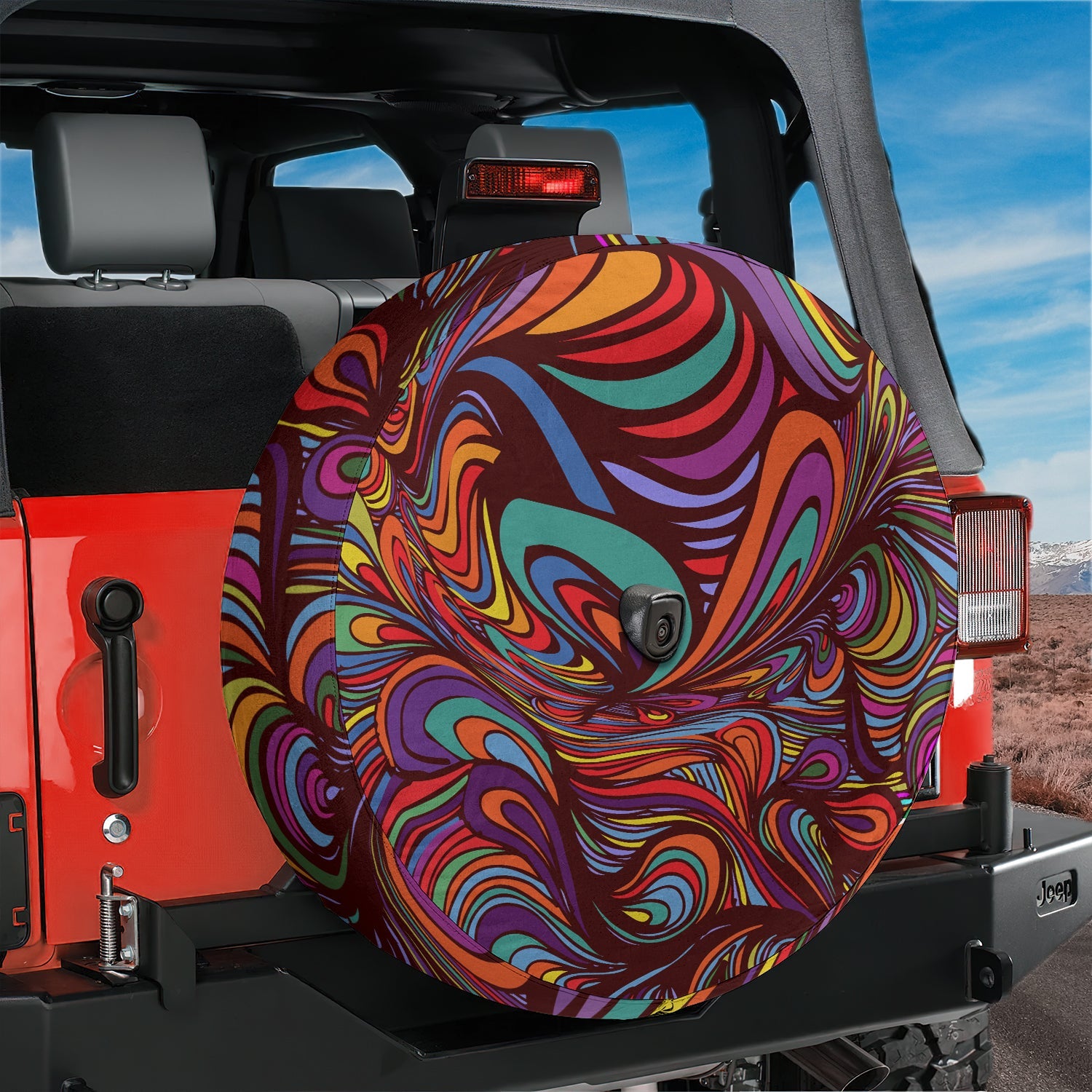 Kaleidoscopic Abstract Dream rainbow swirl tire cover mounted on red Ford Bronco rear with red rocks