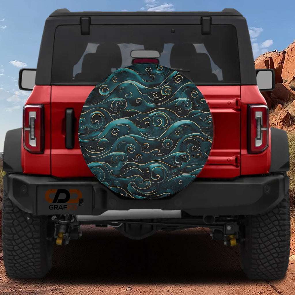 Golden Teal Waves tire cover on a red Ford Bronco with swirling teal ocean wave pattern and gold accents