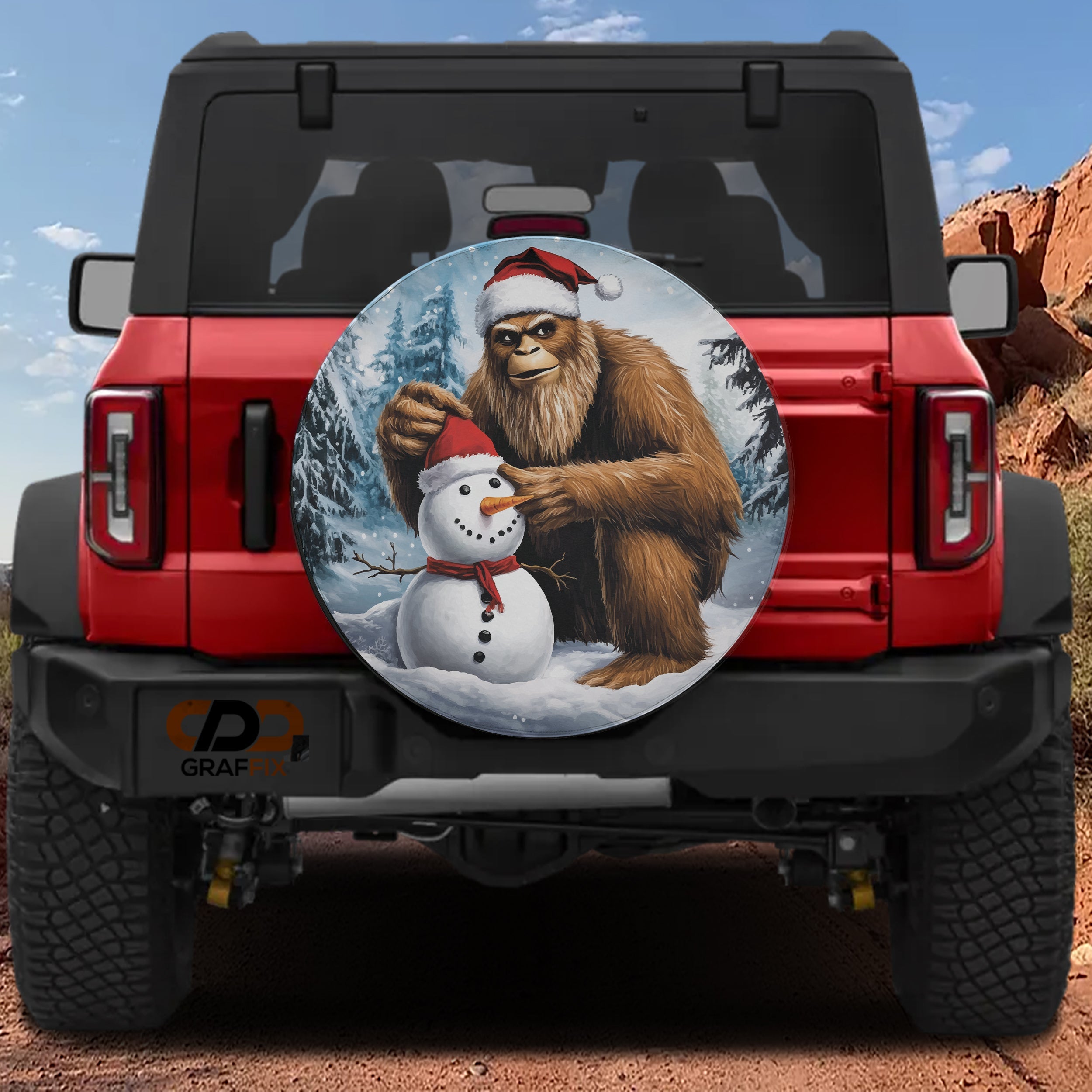 Red Ford Bronco rear with Bigfoot Sasquatch building snowman cartoon spare tire cover winter art