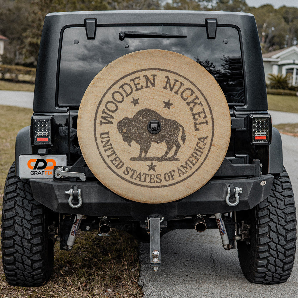 American buffalo wooden nickel spare tire cover on red Ford Bronco with vintage bison coin