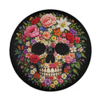 A colorful and intricate floral design of a skull, with various flowers and leaves surrounding the skull's face.