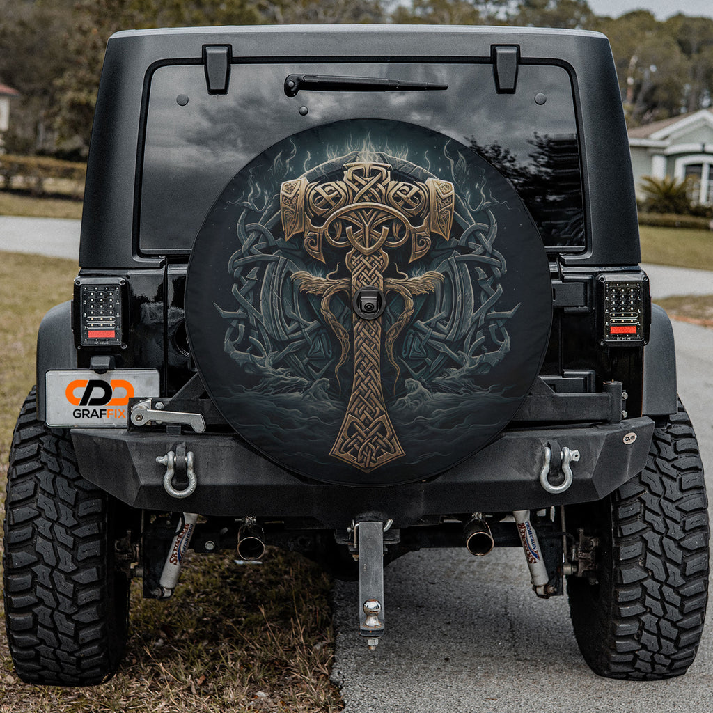 the rear of a black Jeep Wrangler with a large, detailed graphic on the spare tire cover.