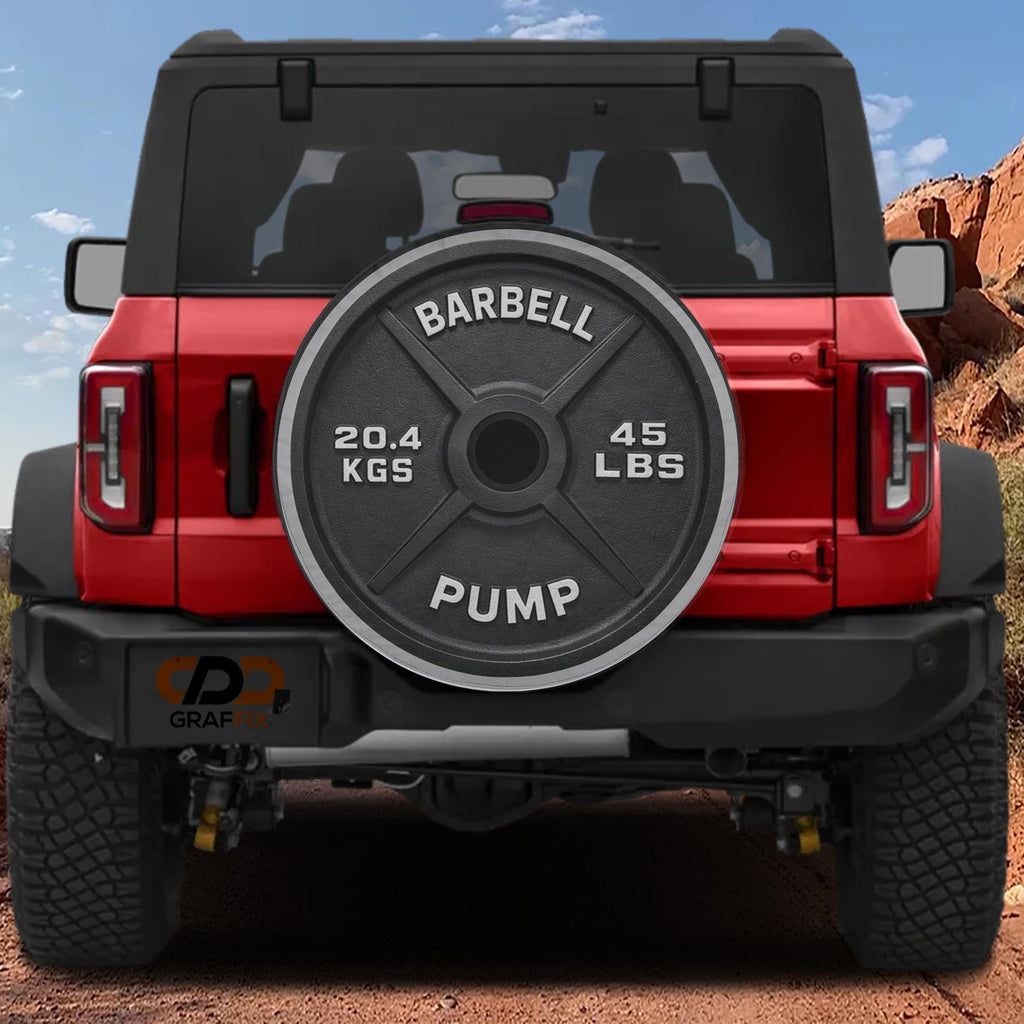 a red Jeep Wrangler with a barbell weight attached to the rear of the vehicle.