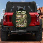 A red Jeep Wrangler with a tire cover featuring a graphic of a man holding a large green plant and the text "Soylent Green" and "It's Made of People".